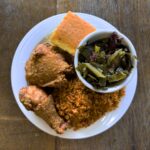 A plate of fried chicken and collards at Shug's in Summerville