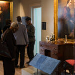 Visitors viewing the Conversations of Freedom exhibit at Middleton Place