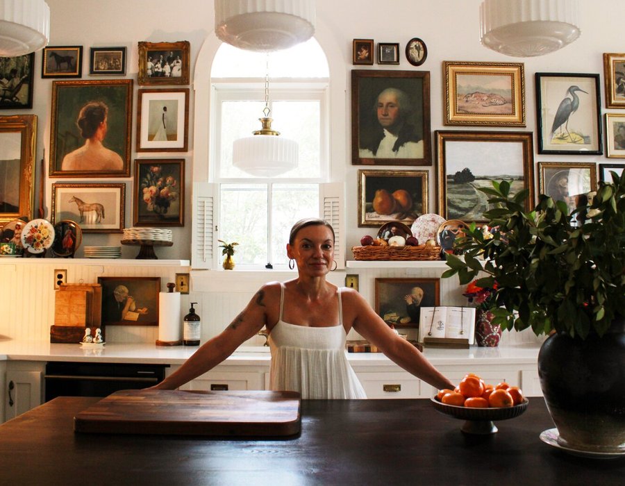 Erin Carlson at the island in the kitchen of her 1880 Summerville home
