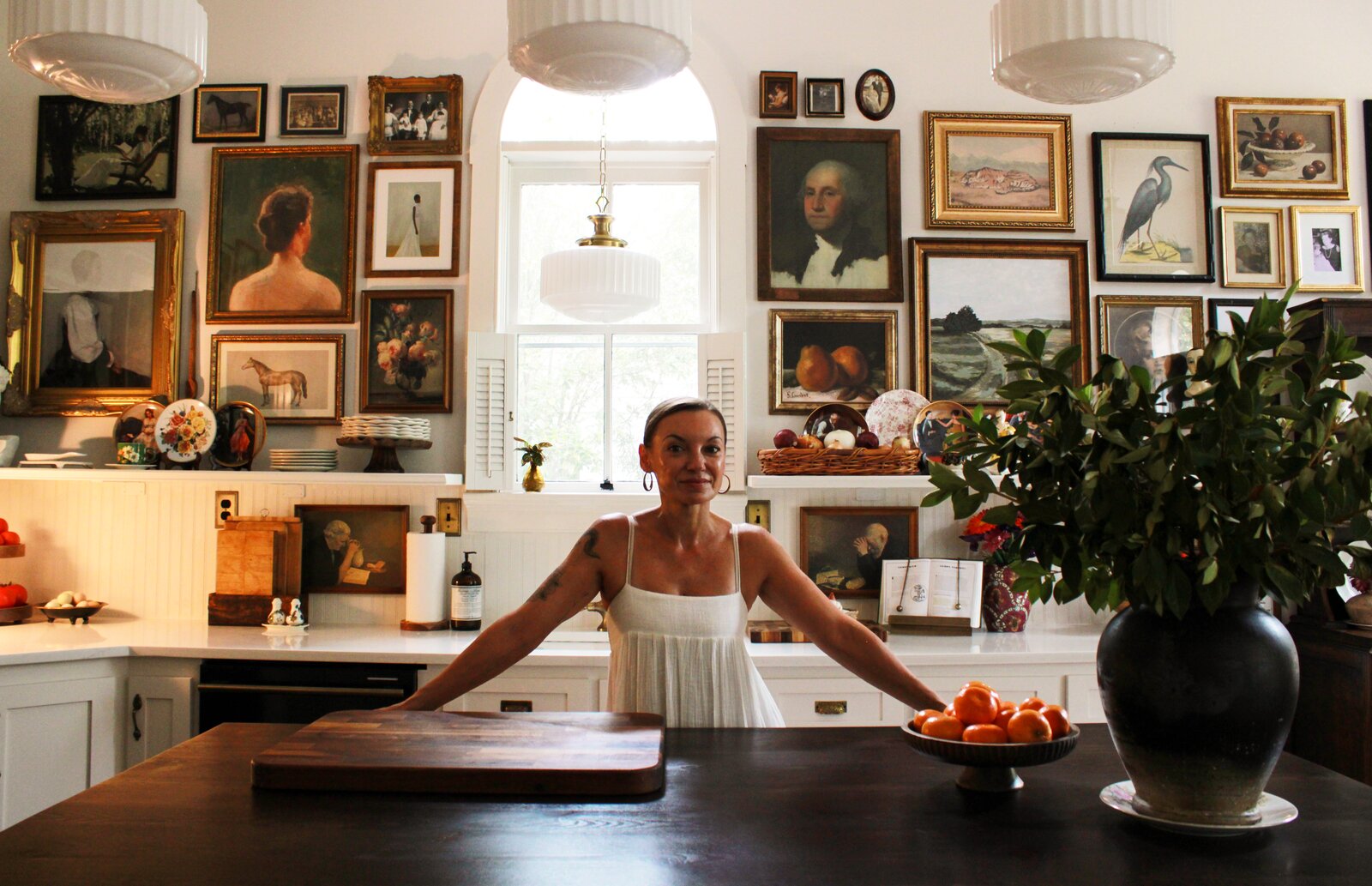 Erin Carlson at the island in the kitchen of her 1880 Summerville home
